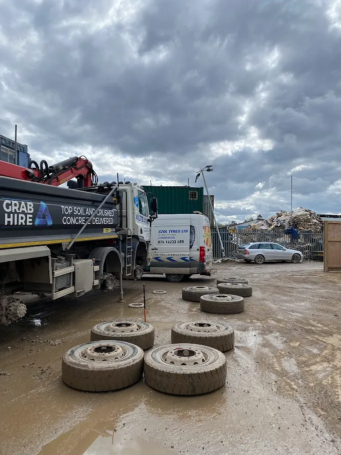 A dump truck is parked in a lot.