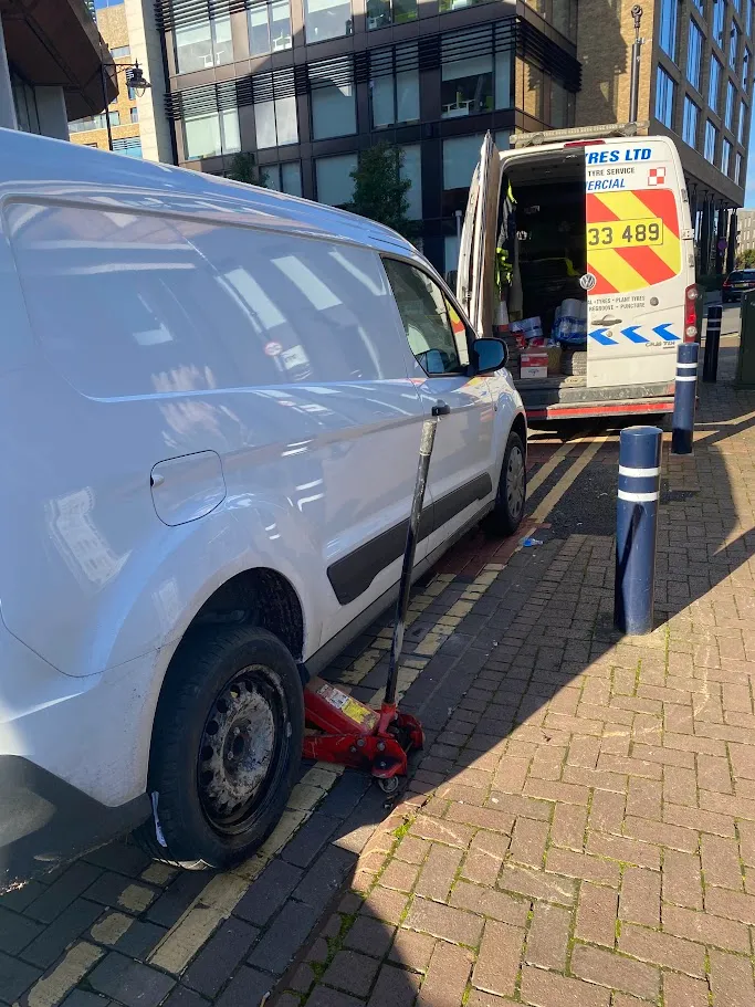 A van is parked on the side of the road.