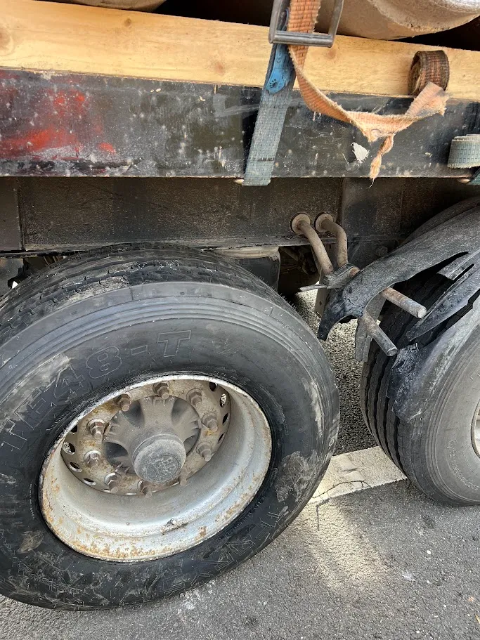 A close up of a flatbed truck tire.